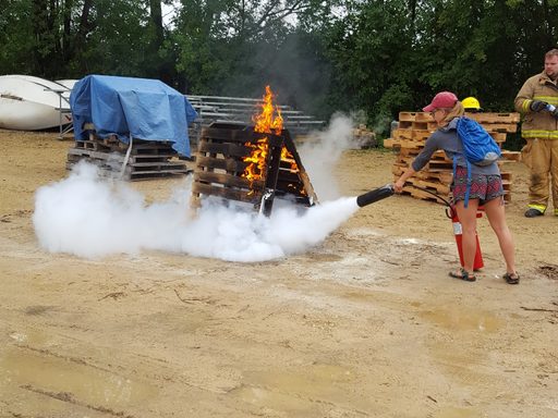 Students learn to use fire extinguishers