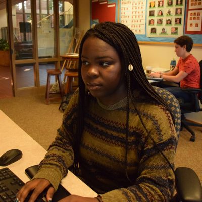 A student engaged with her work-study position