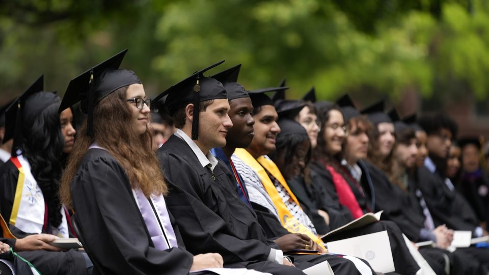 Students sitting at commencement