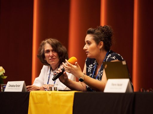 Two faculty members at a reunion event