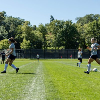 soccer players practicing on a field