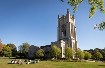 students studying outside of the chapel