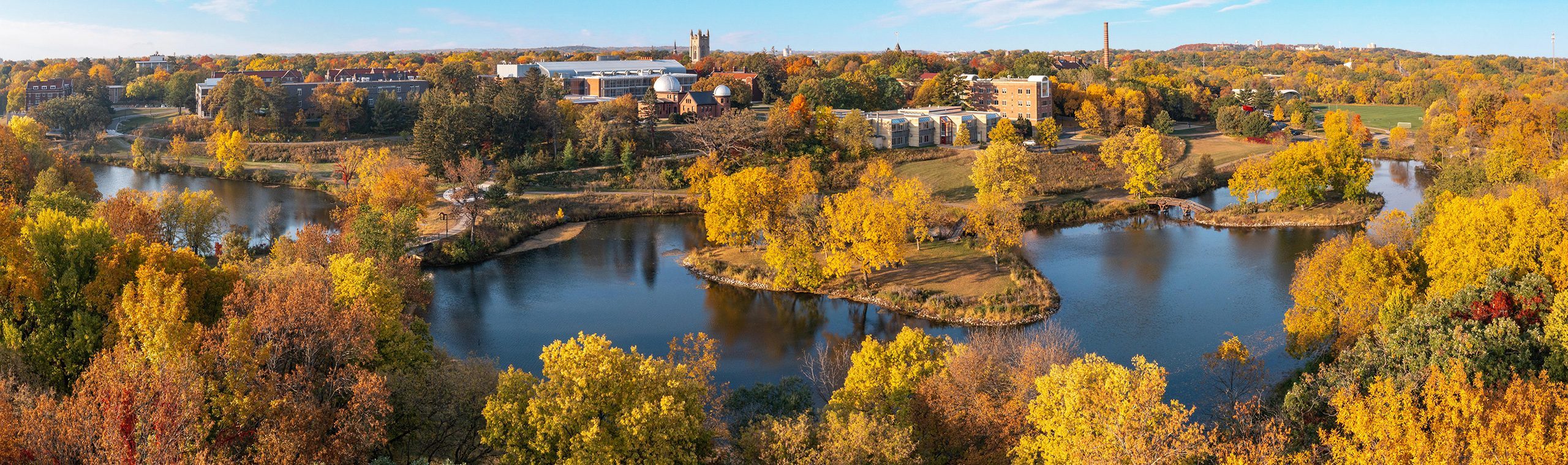 Aerial panorama of the Carleton campus, with the Lyman Lakes in the foreground