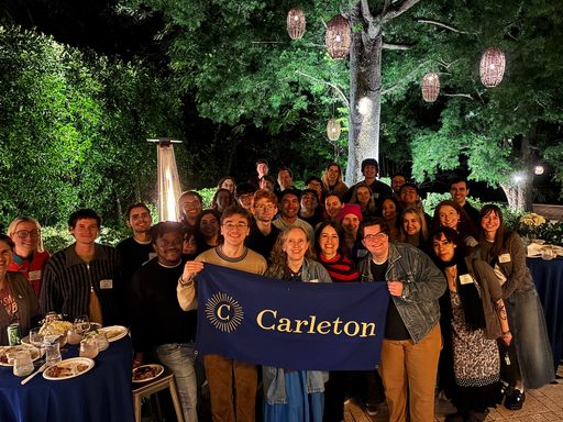 alumni group with carleton flag