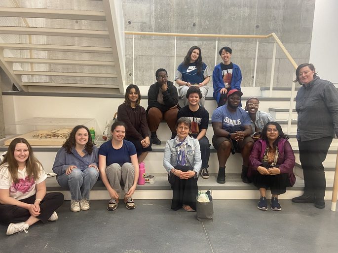 GWSS students and faculty posing for a group photo in the Weitz basement at the spring '24 Strawberries & Chocolate Celebration.
