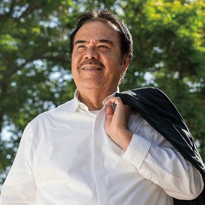 Martín Ahumada holding a jacket over his shoulder