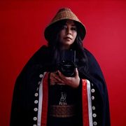 Matika Wilbur, holding a camera.
