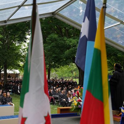 students at commencement, as seen from behind the stage