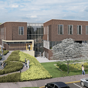 Rendering of a large, brown brick building with big windows, surrounded by grass and trees.